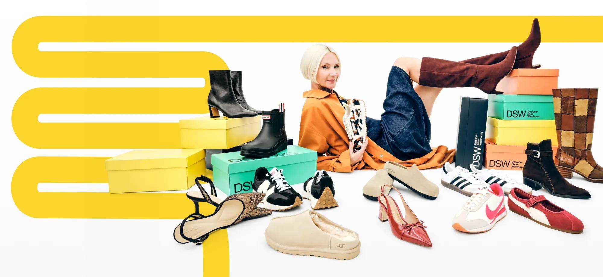 Featuring a woman with a wide assortment of shoes for fall.