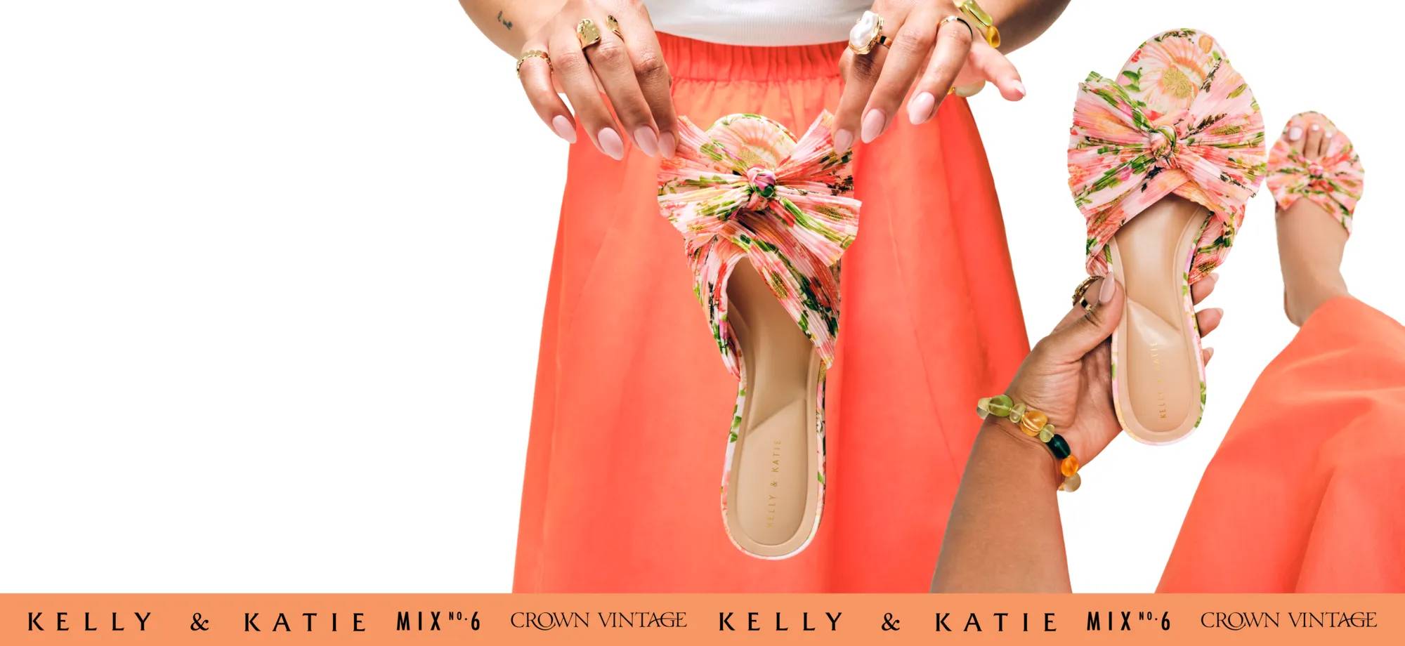 Hand holding up a floral pattern sandal with a foot wearing a floral pattern sandal