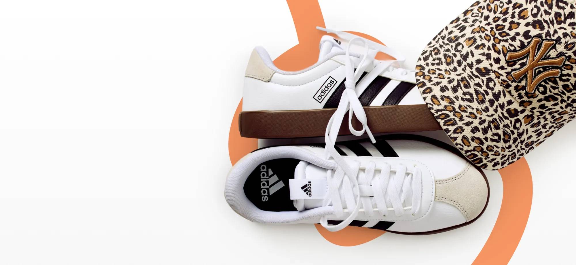 Featuring an pair of adidas sneakers and an animal print hat.