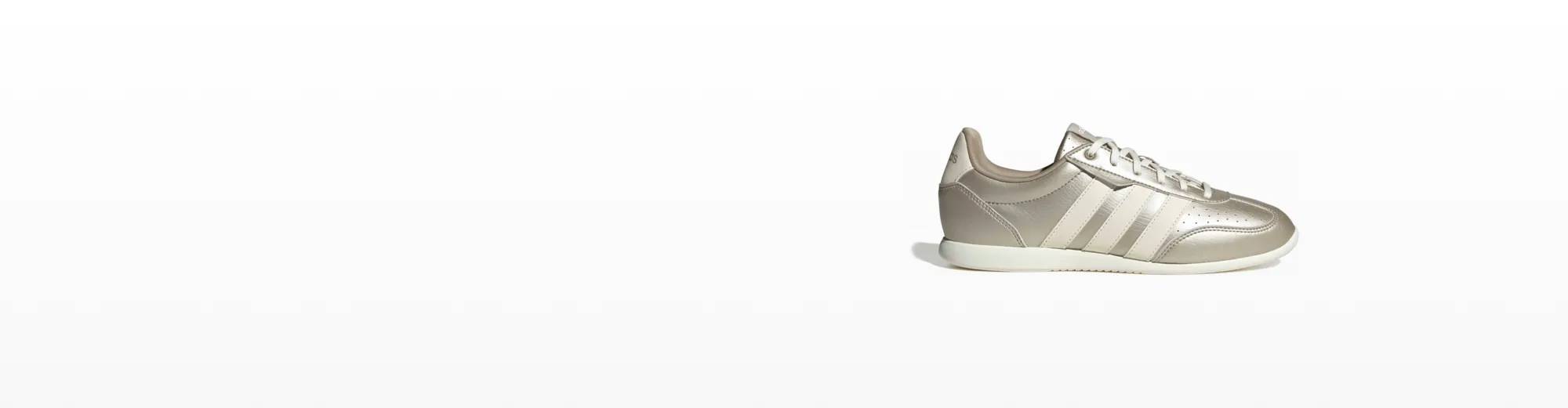 Featuring a pair of silver sneakers from adidas.