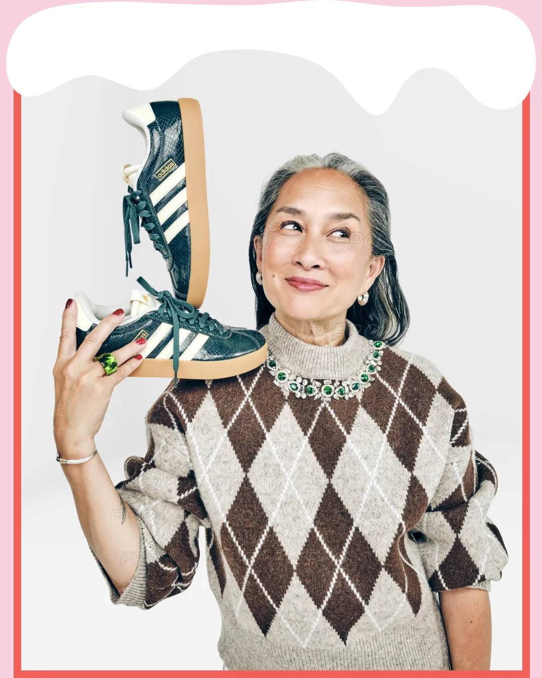 Featuring a model holding up a pair of adidas mary jane sneakers.