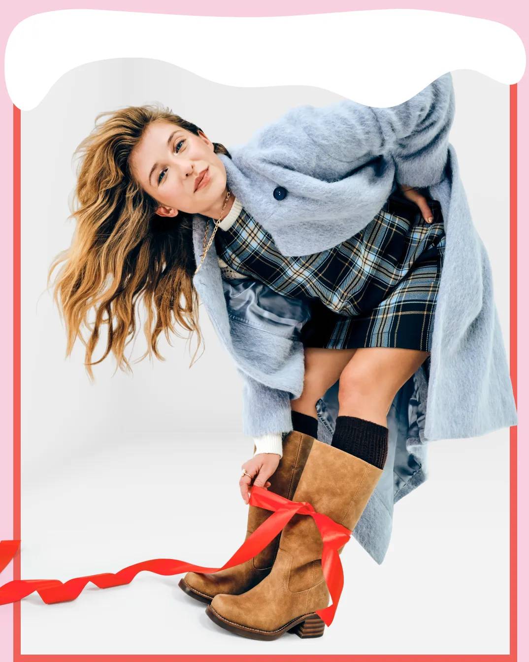 Featuring a model wearing tall boots from Frye & Co.