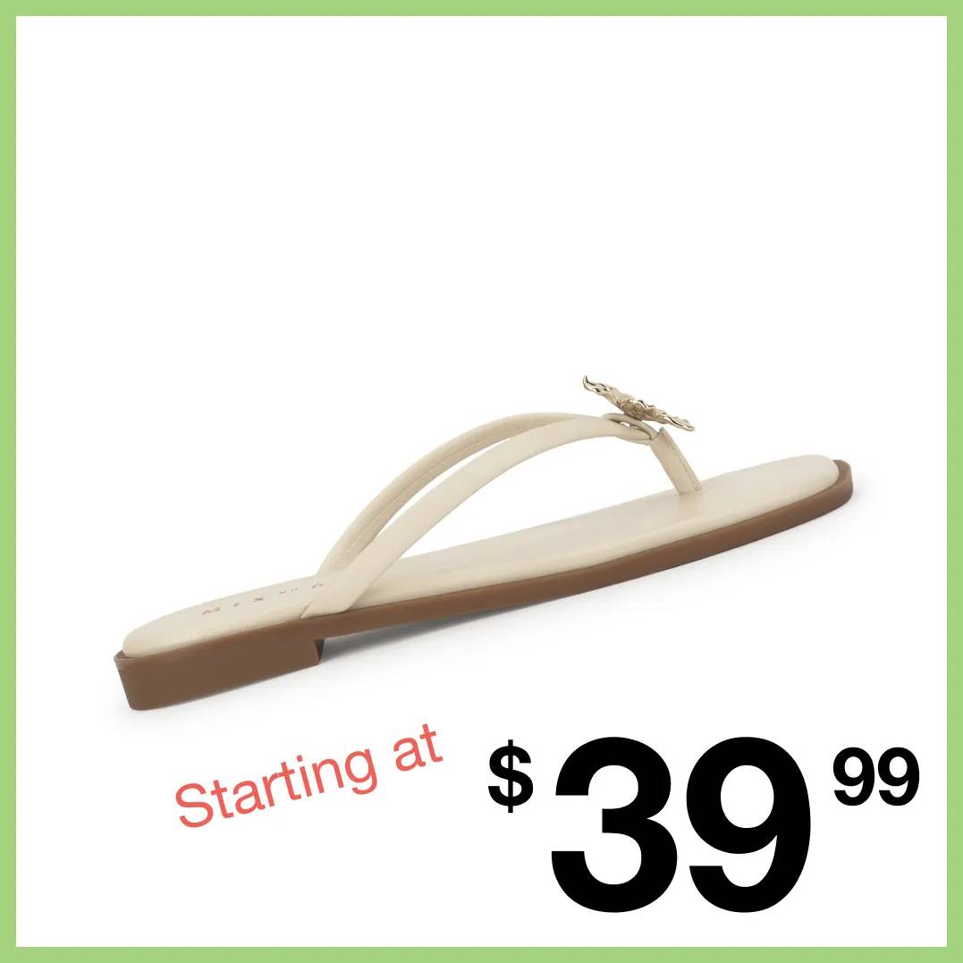 Featuring a women's white flat sandal.