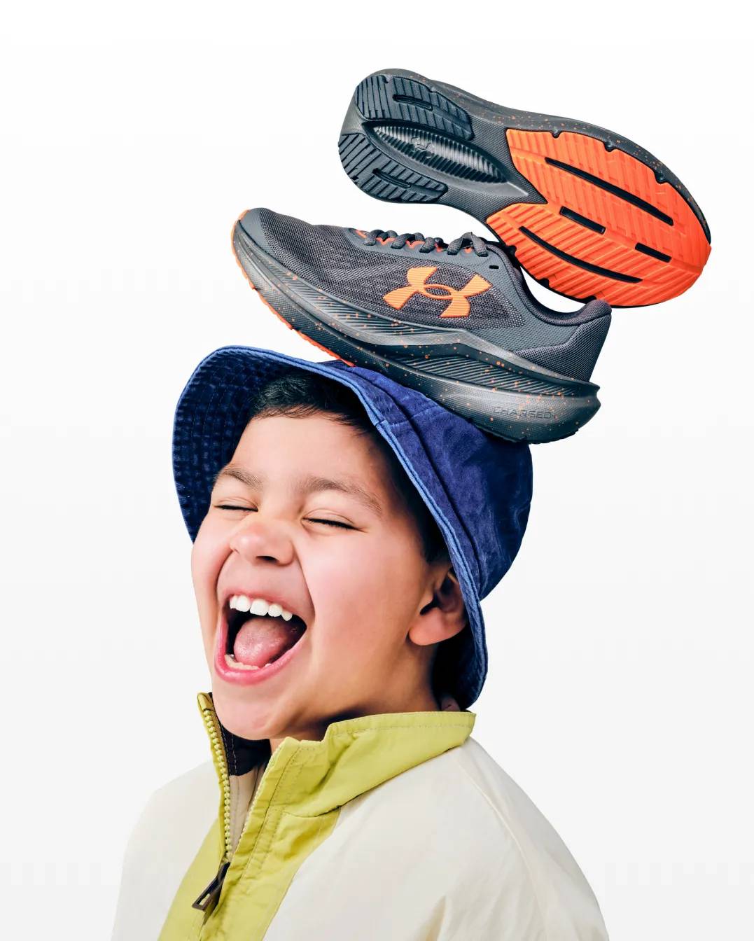 Featuring a young boy with sneakers on his head.