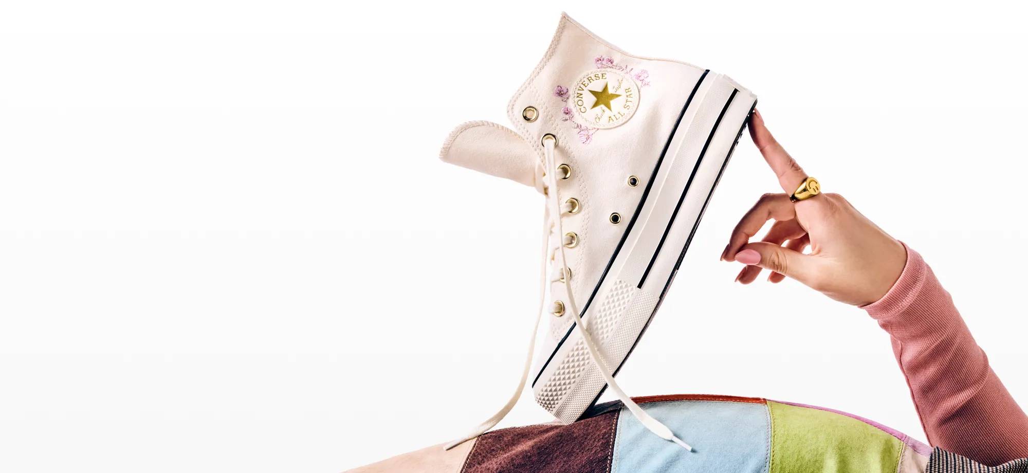 Featuring a Converse sneaker.