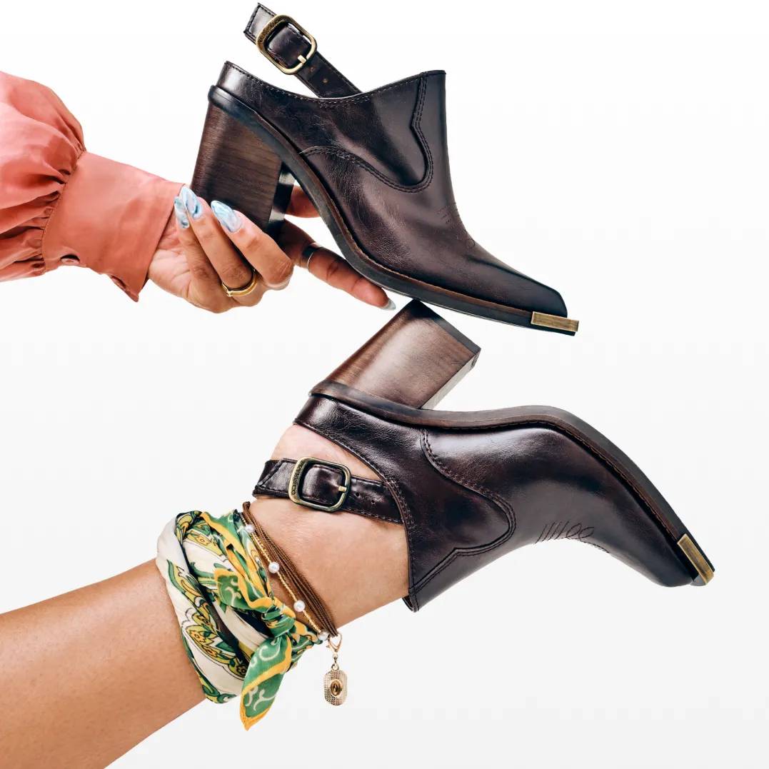 Featuring a pair of tall suede boots.