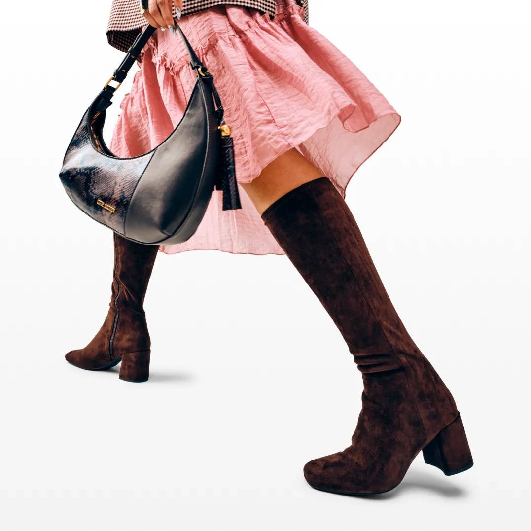 Featuring a model in tall brown suede boots