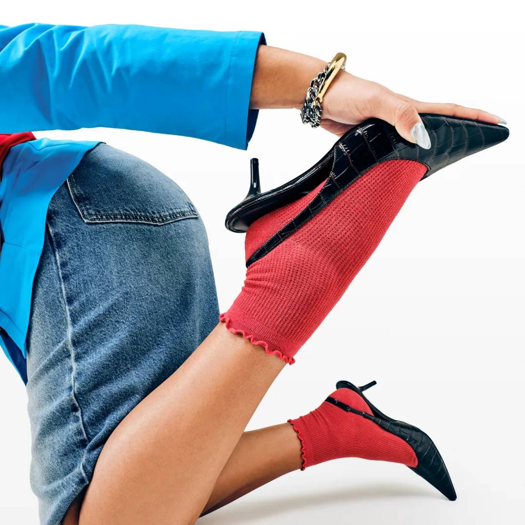 Featuring a model in brown suede boots and denim outfit.