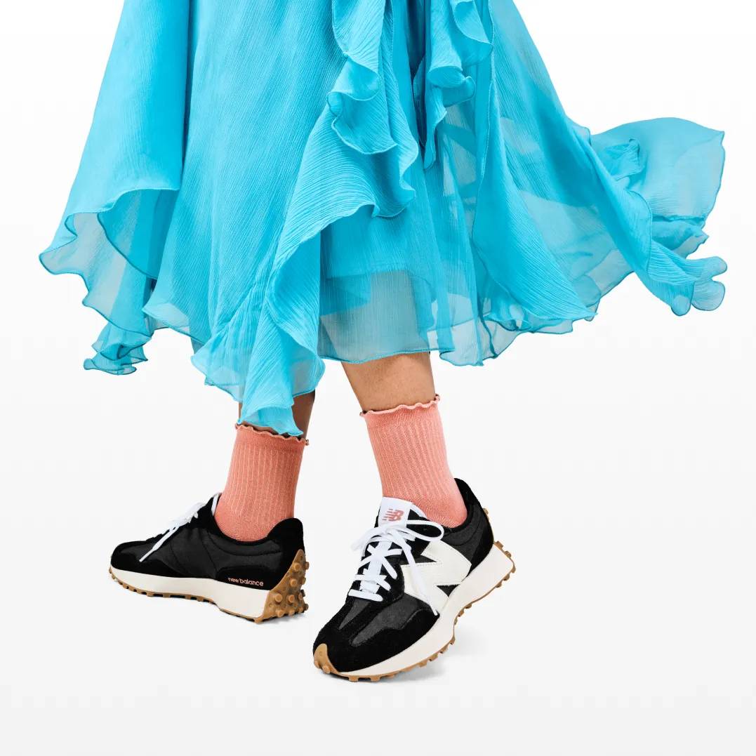 Featuring a model in metallic adidas sneakers