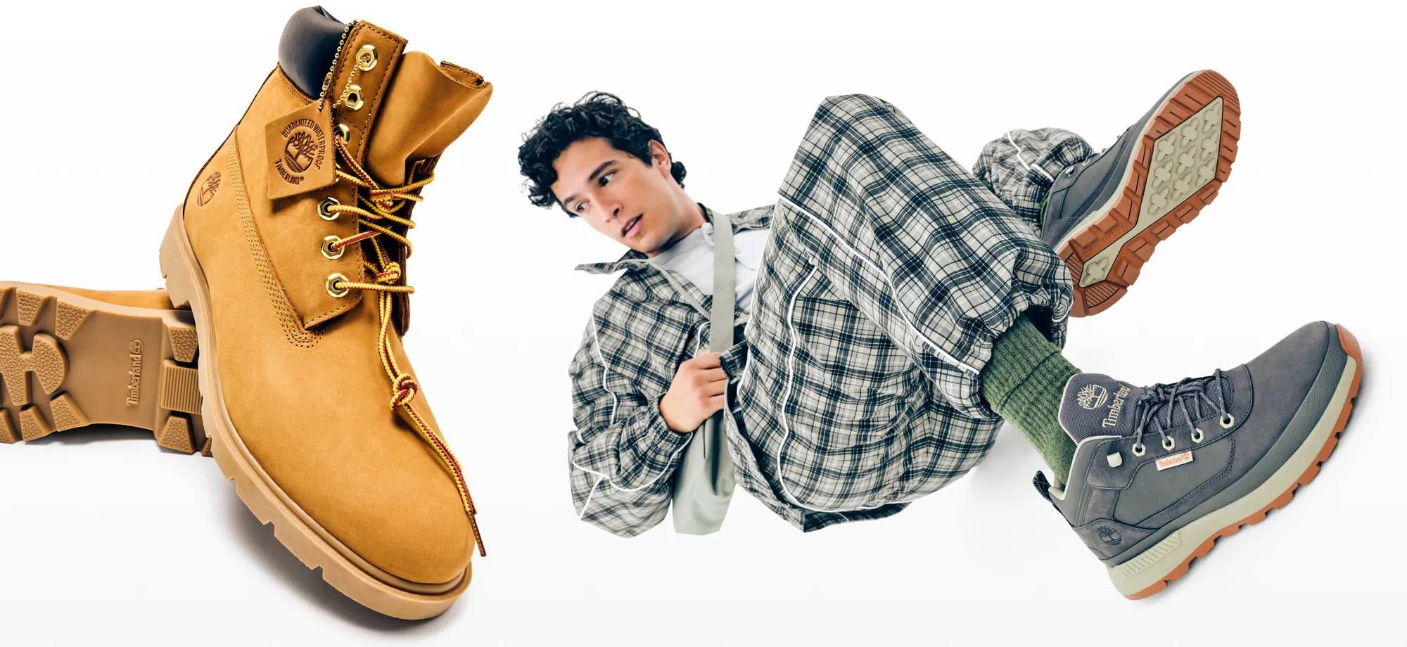 Model wearing the hottest men's boots trends for fall. Read all about what shoes you should snag before the weather cools down.
