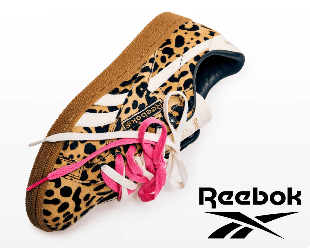 Featuring a pair of animal print sneakers from Reebok, with pink shoelaces.