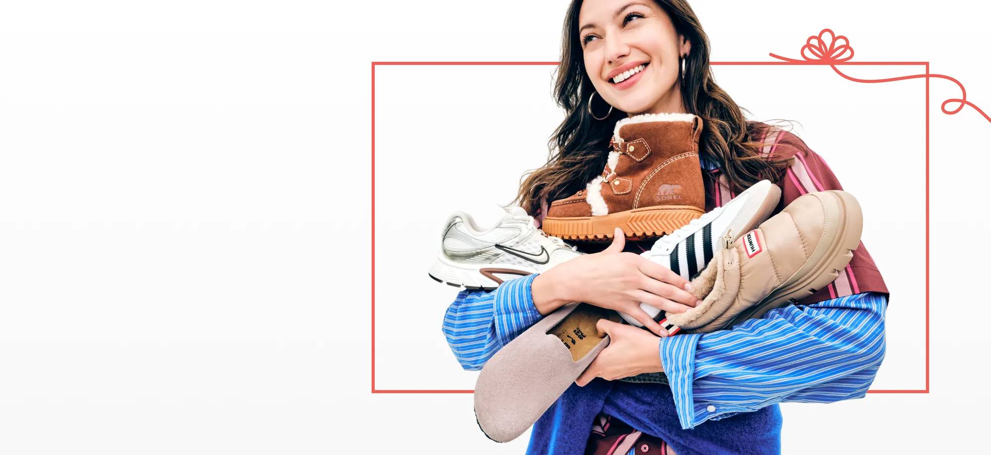 Featuring a woman holding an assortment of shoes for the whole family this holiday season.