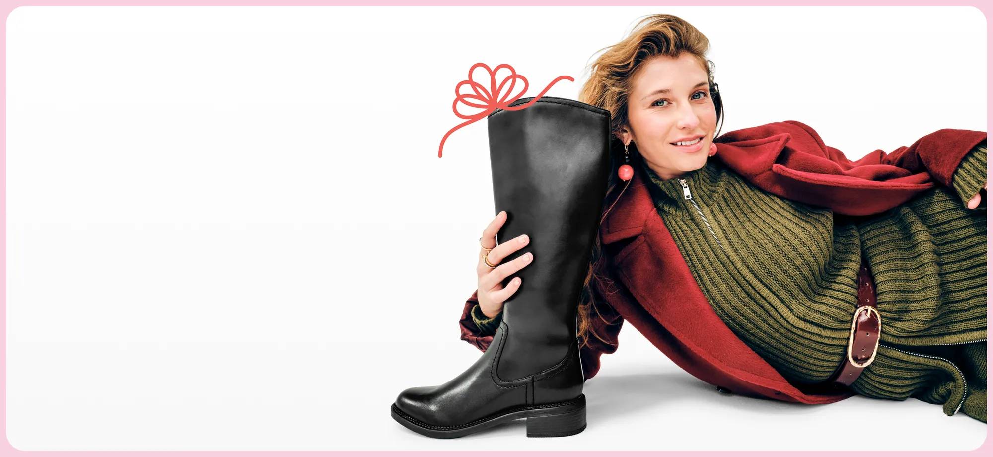 Featuring a woman holding a brown tall boot.