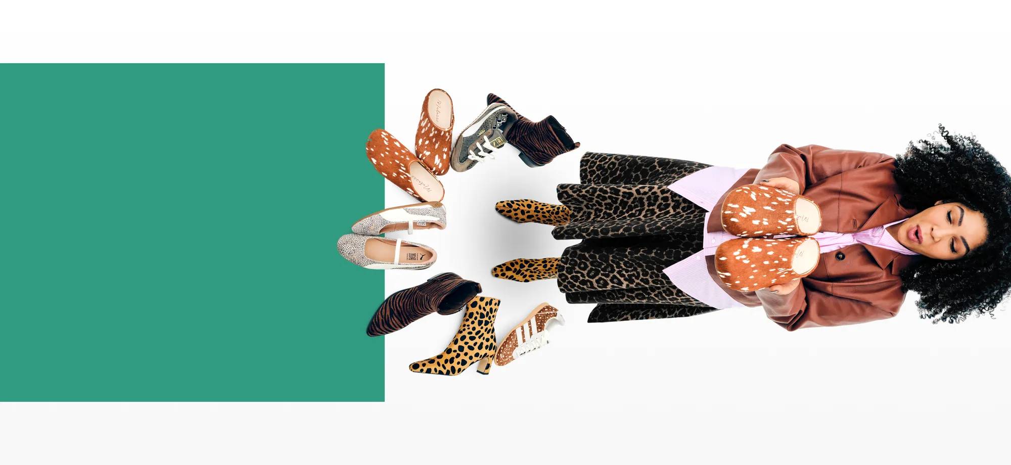 Featuring a woman surrounded by an assortment of animal print shoes.