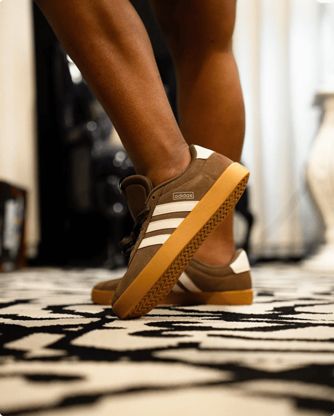 Featuring brown adidas court sneakers.