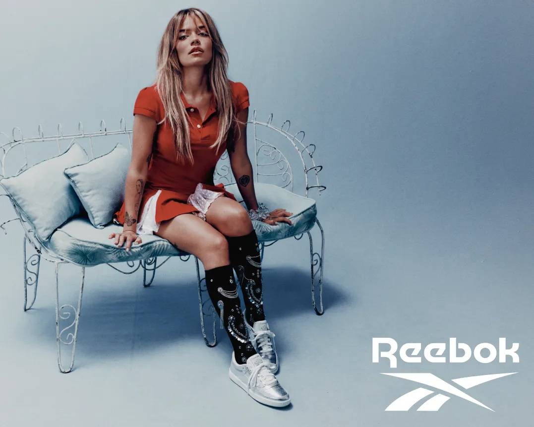 Featuring Karol G wearing Reebok