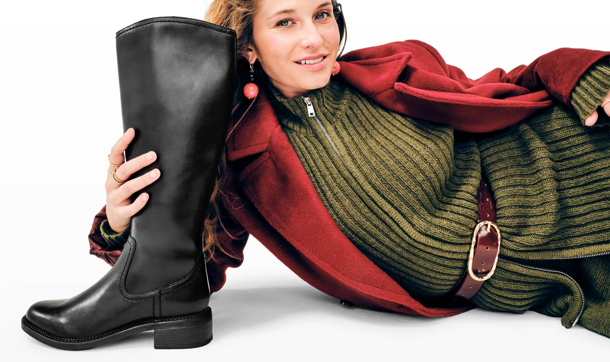 Women with tall pair of riding stye boots.