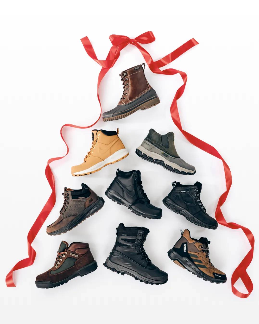 Featuring an assortment of men's boots, laid out in the shape of a Christmas tree.