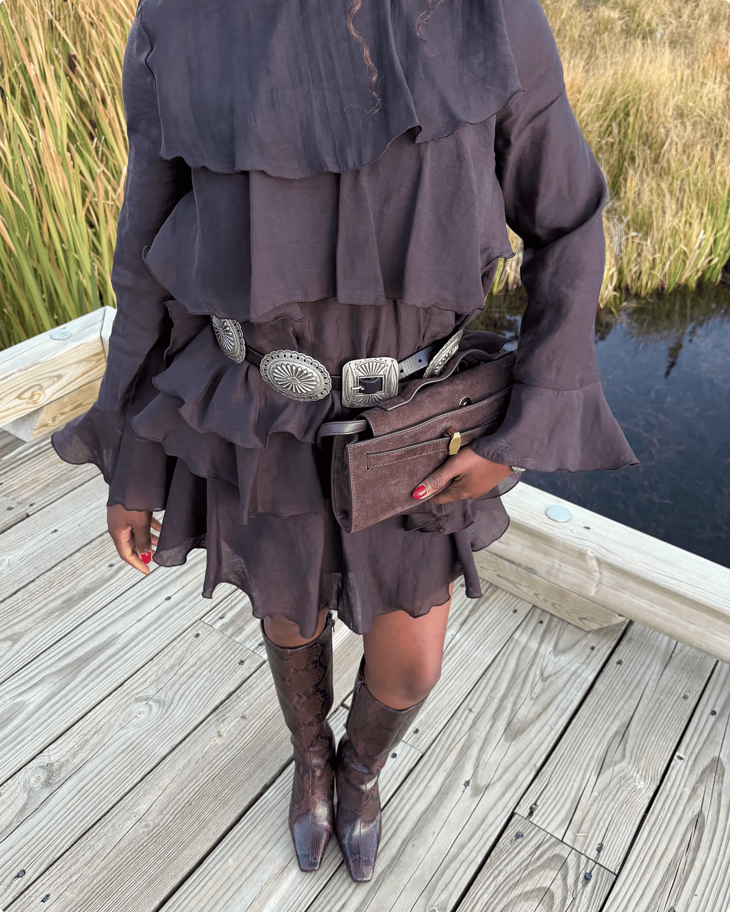 Featuring Barbarah William wearing snakeprint tall boots.