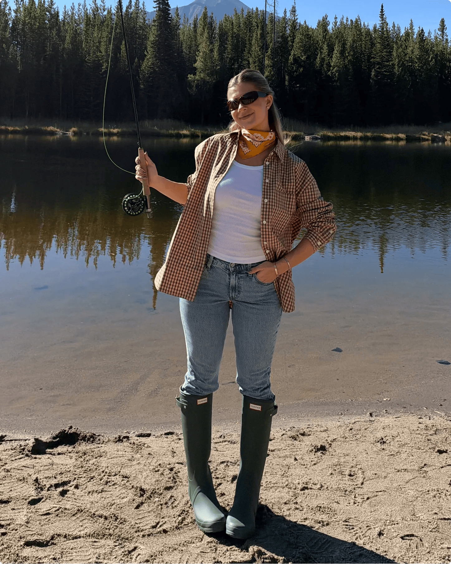 Featuring Danielle Carolan in a pair of tall green HUNTER boots.