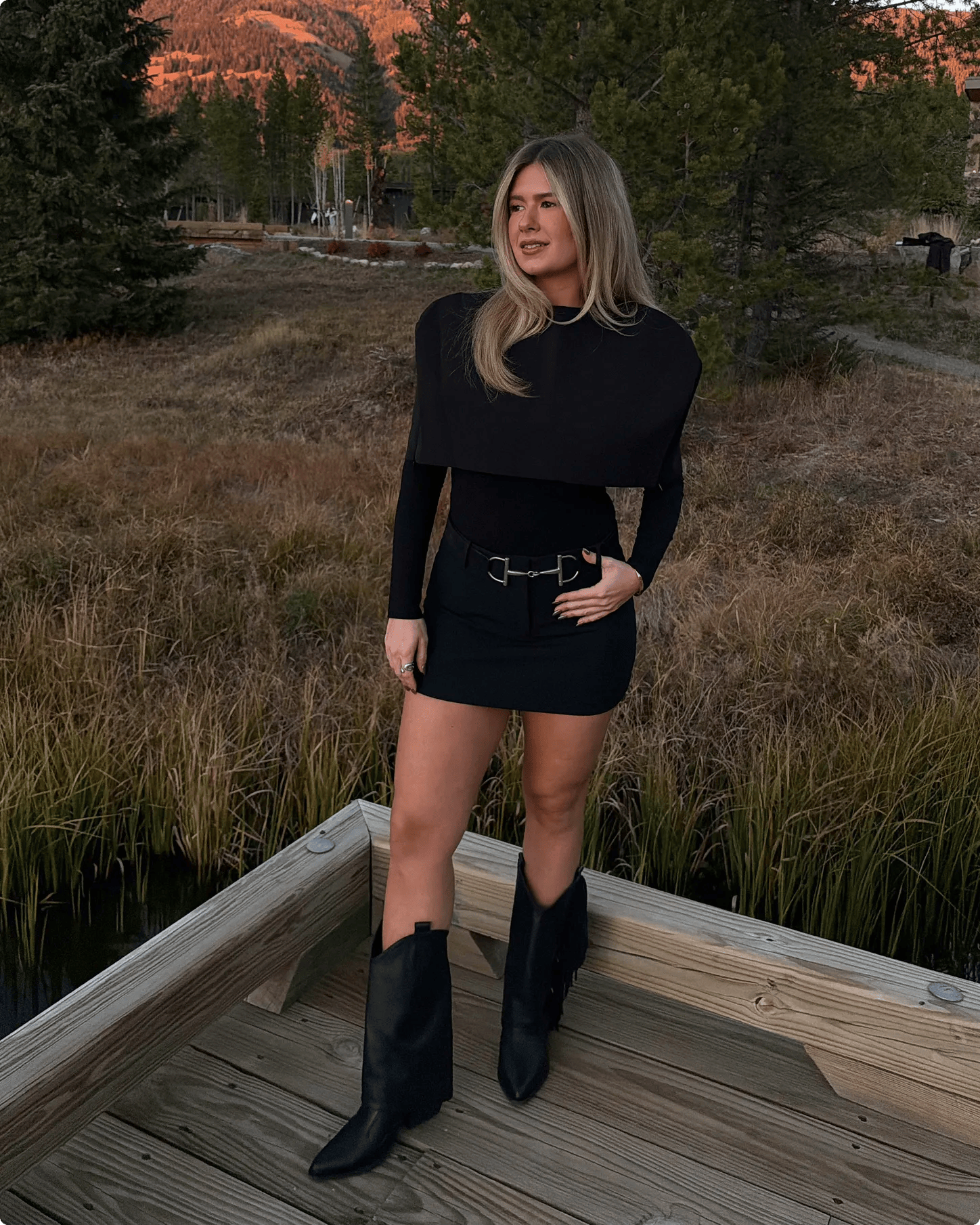 Featuring Danielle Carolan in a pair of black cowboy boots with fringe.