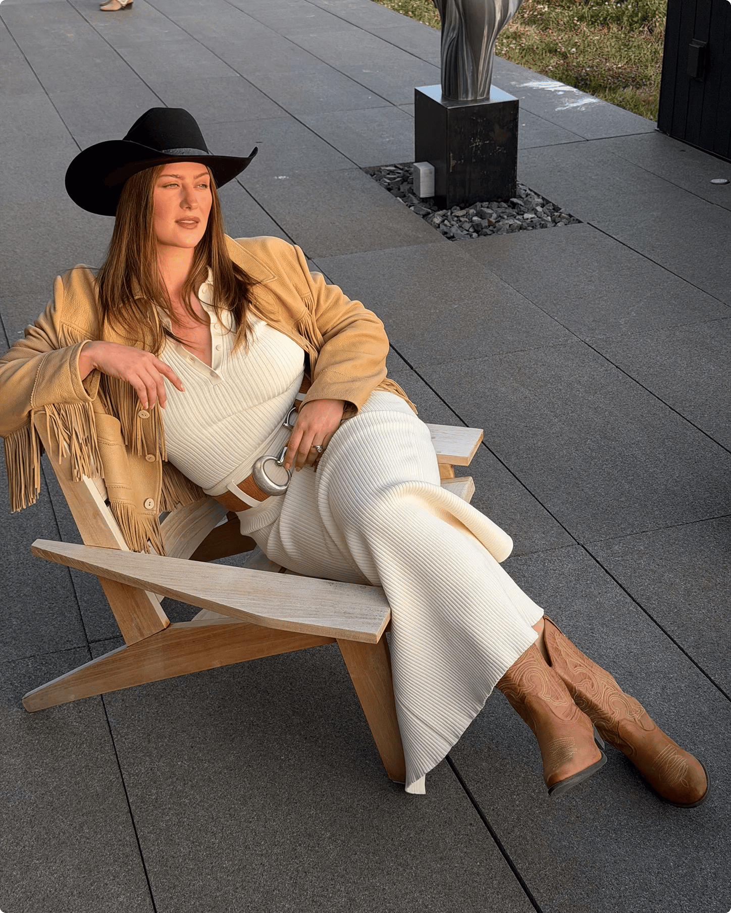 Featuring Raeann Langas wearing brown cowboy boots.