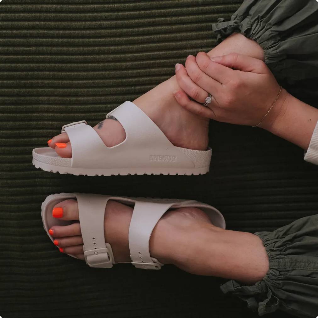 Woman wearing beige Birkenstock EVA sandals