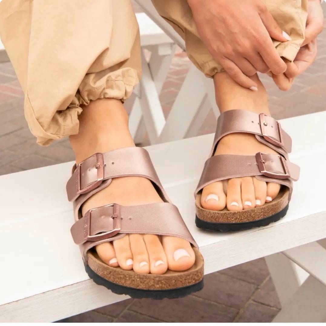 Close up shot of woman wearing Birkenstock footbed sandals