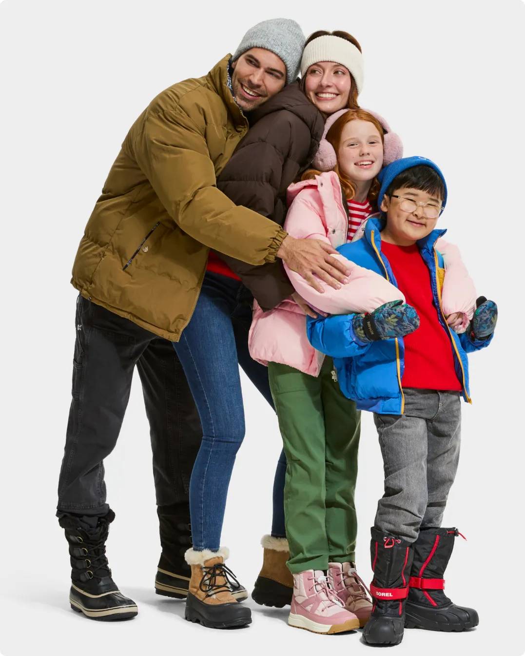 Family wearing boots and winter clothing