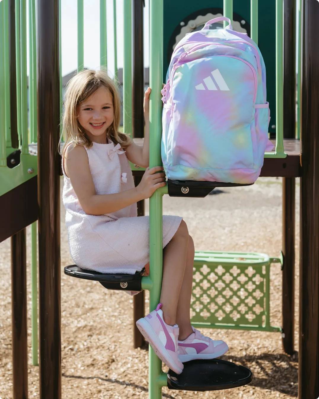 Girl at the park with a backpack
