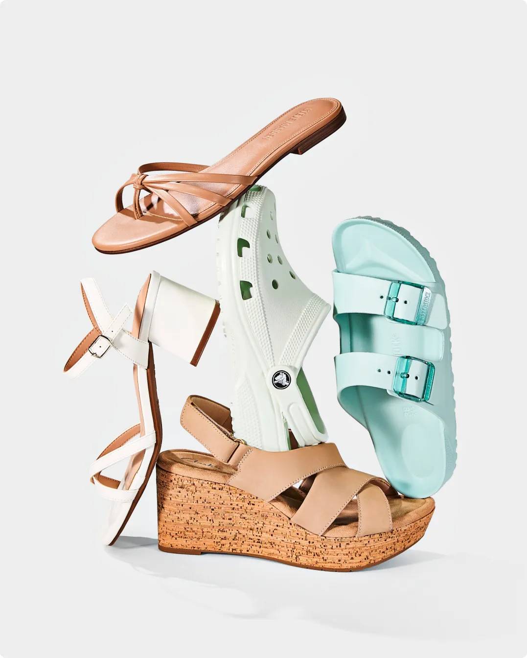 5 different sandals including a Crocs style, a flat sandal, a platform sandal, a Birkenstock EVA, and a block heel sandal