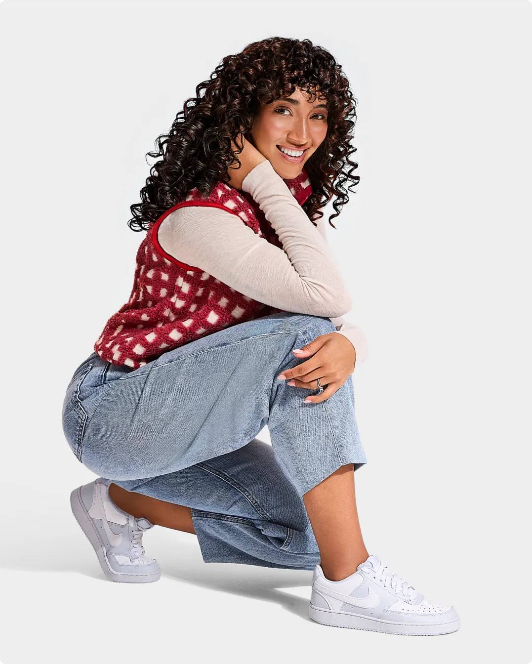 Woman wearing white Nike sneakers
