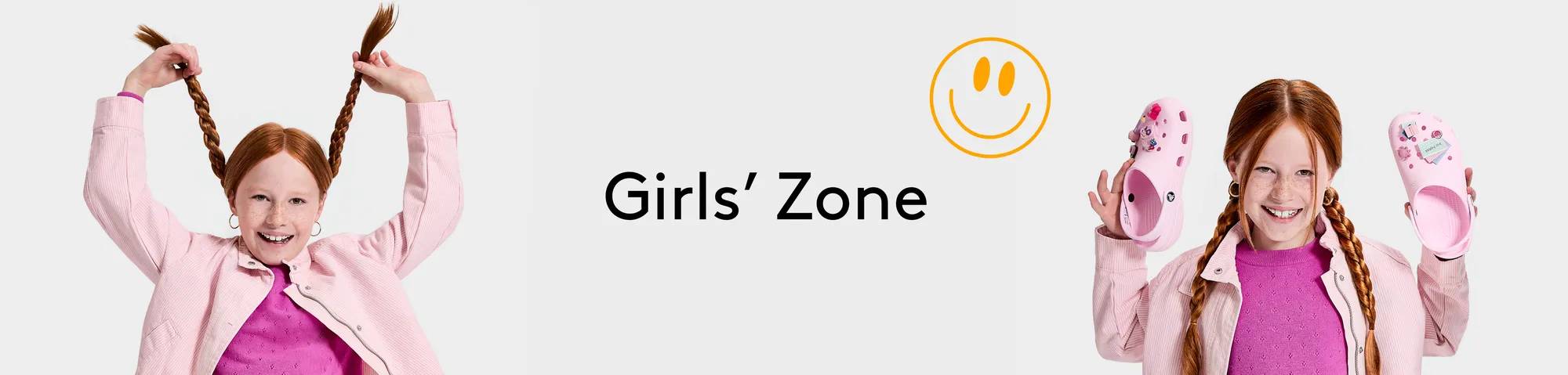 A girl holding a pair of shoes | Girls' zone
