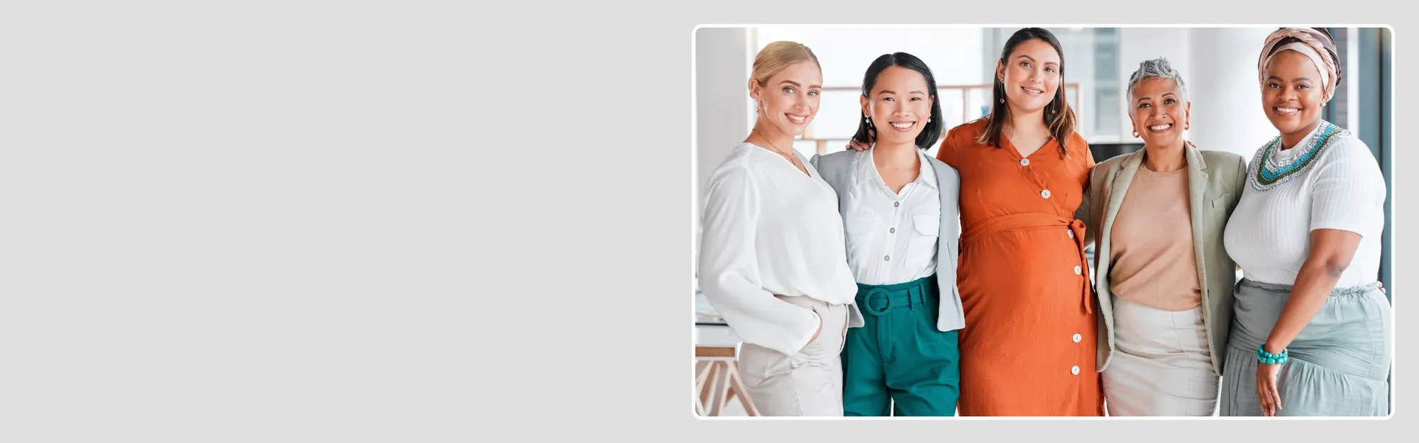 Group of 5 women smiling and posing for a picture