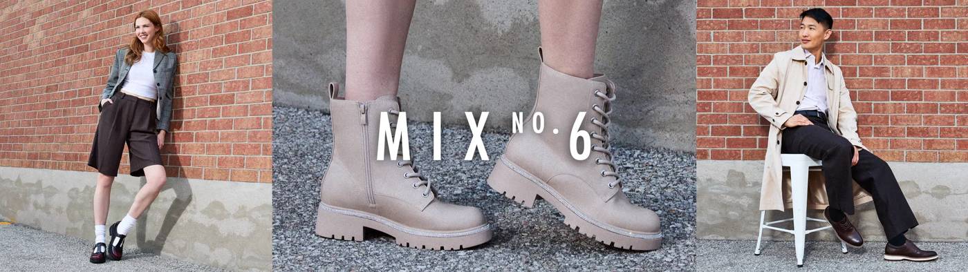 Woman leaning against brick wall wearing black loafers
