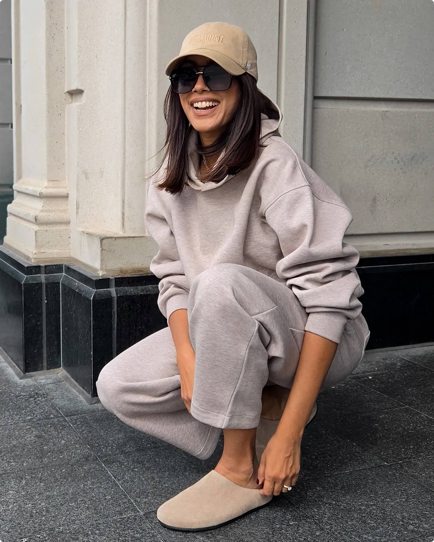 Influencer Kimberley Marquis crouching and laughing