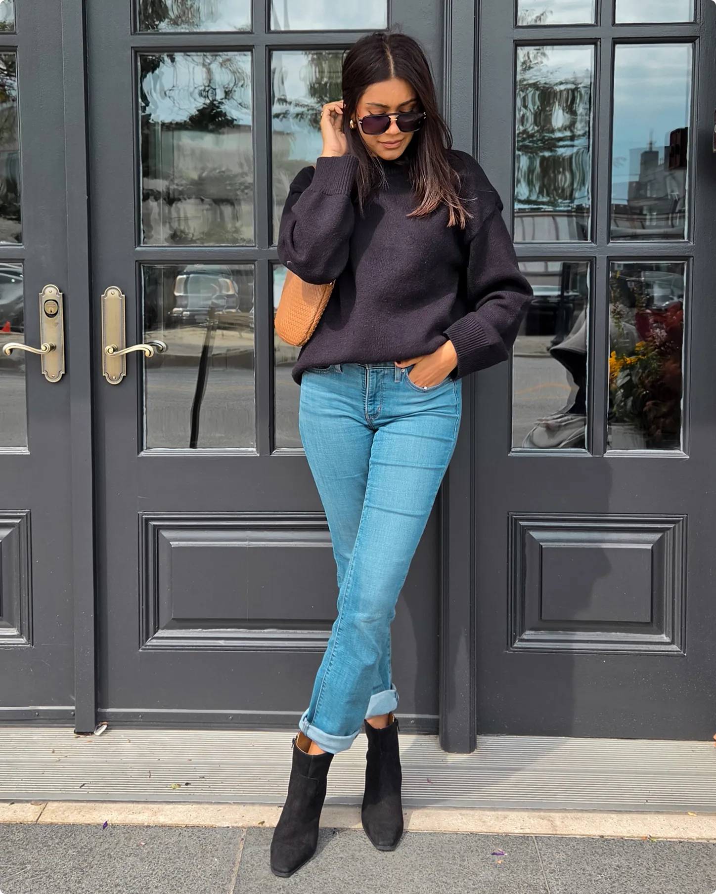 Influencer Kimberley Marquis wearing black booties